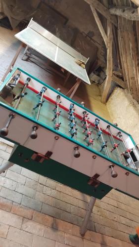 a pool table with keys on top of it at gîte 8 personnes Les Marqueries in La Flèche