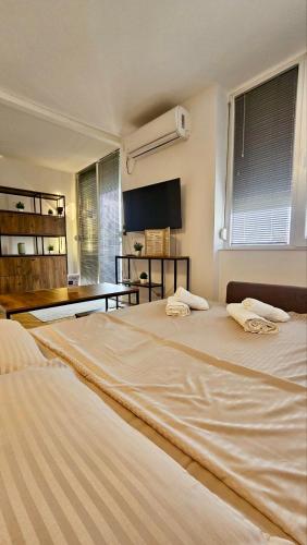 Кровать или кровати в номере Harmony Suite 32
