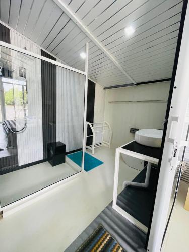 a small bathroom with a sink and a window at Feyola`s Leaf in Pelena