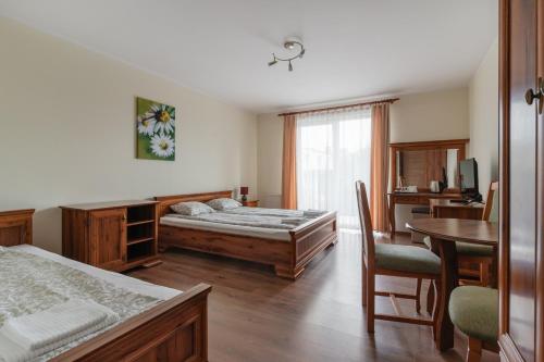 Postel nebo postele na pokoji v ubytování Bakster