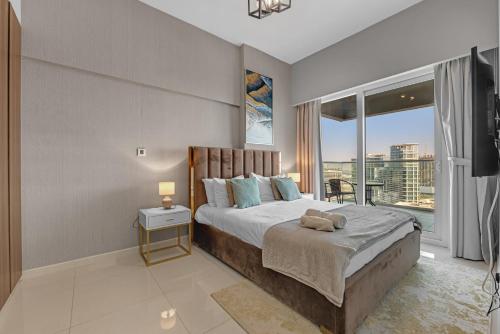 Ένα ή περισσότερα κρεβάτια σε δωμάτιο στο Wonderful Reva Aparthotel Downtown