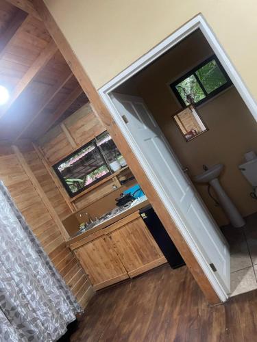 an overhead view of a bathroom with a sink and two windows at Villas Seashells in Uvita