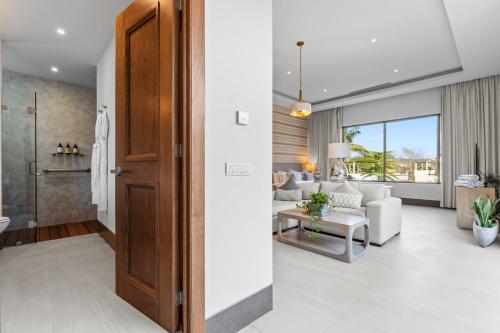 a living room with a couch and a table at Peaceful Retreat with Pool – Ideal for Relaxation in Cruz de Huanacaxtle