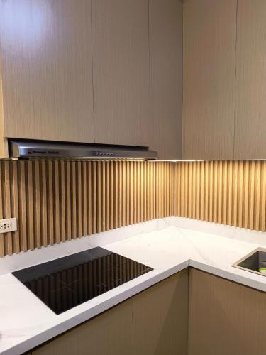 a kitchen with a stove and a counter top at Casathea Hometel Cebu in Talisay