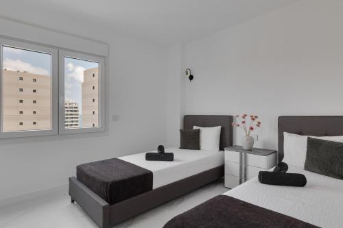 Postel nebo postele na pokoji v ubytování Coral Posidonia