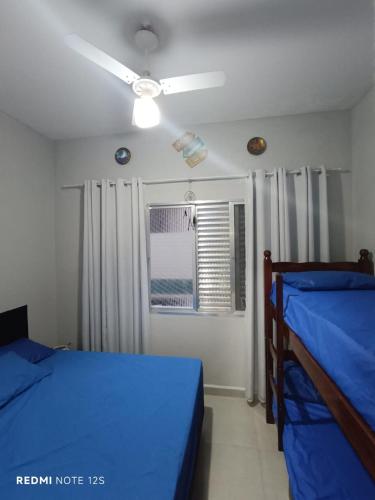 Voodi või voodid majutusasutuse Aconchego do mar - Canto do Forte - Praia Grande toas