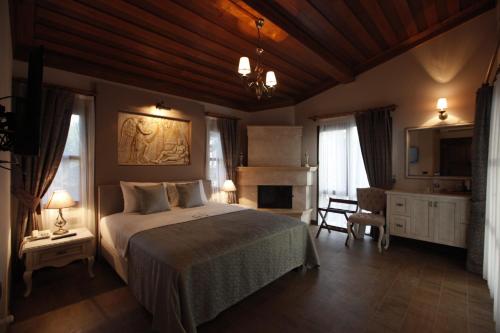 A bed or beds in a room at Livia Hotel Ephesus