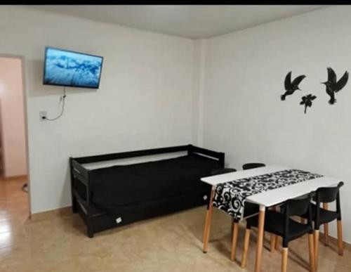 TV a/nebo společenská místnost v ubytování La fortaleza A una cuadra de la terminal