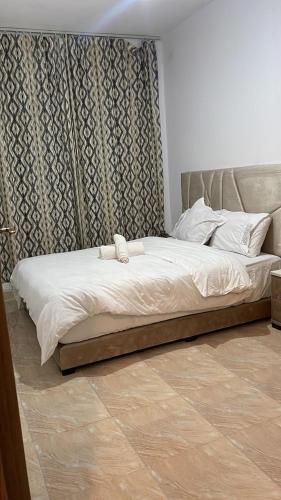 Giường trong phòng chung tại High apartment