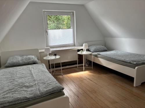 En eller flere senge i et værelse på Großhandsdorf Gästehaus