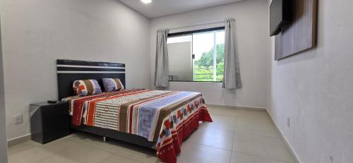 Ένα ή περισσότερα κρεβάτια σε δωμάτιο στο Moderno departamento en Lambaré cerca de todo