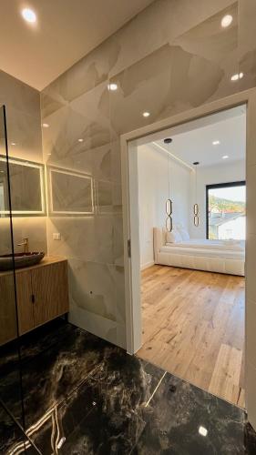 a living room with a large glass wall at Alpine Loft in Kapfenberg