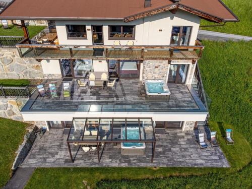 an aerial view of a house with a patio at Deluxe Suite Goldreh in Kaltenbach