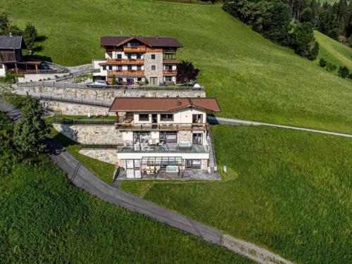 an aerial view of a house on a hill at Deluxe Suite Goldreh in Kaltenbach