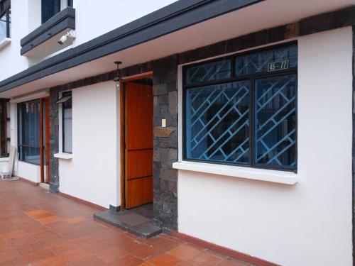 a building with a window on the side of it at casas bosque apartaestudio in Bogotá