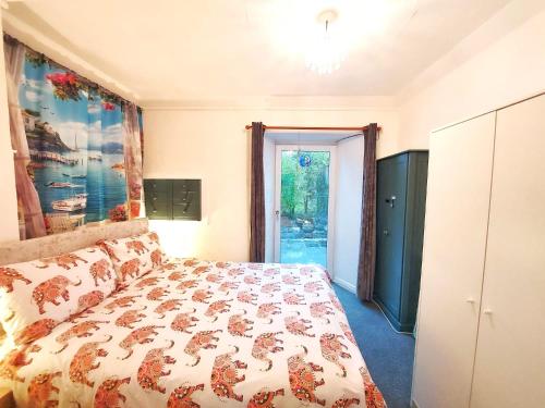 a bedroom with a bed and a window at The Wee Nest in Largs - One-Bedroom Ground Flat in Largs