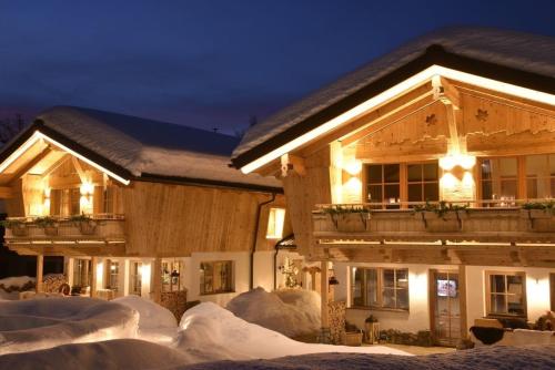 a building with snow on the ground in front of it at Chalet Rustika in Goldanger