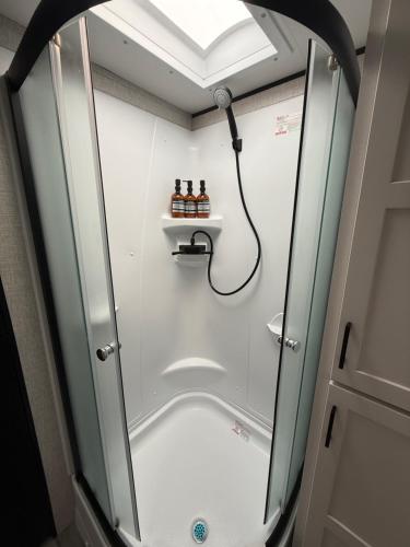 a shower with a glass door in a bathroom at Beachfront Retreat w Pool, Boat Ramp & Dock Rental in Key Largo