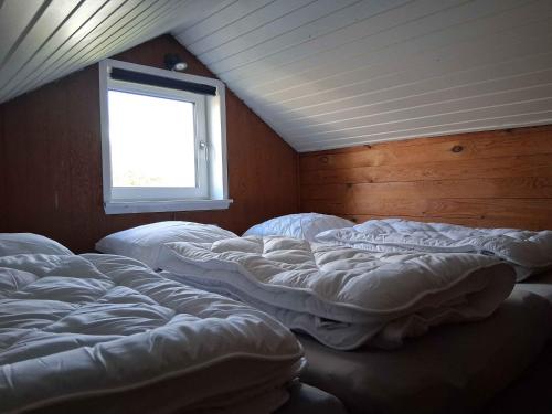 Postel nebo postele na pokoji v ubytování Lille Hus På Landet