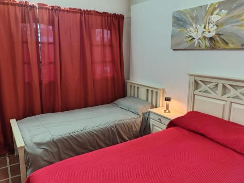 Postel nebo postele na pokoji v ubytování La Carolina Cabañas