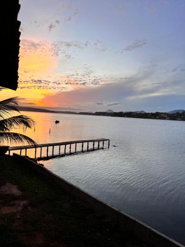 a view of a body of water with a sunset at Casa Vidão da Lagoa in Maricá