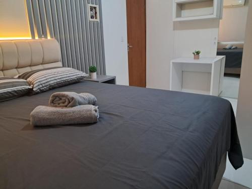 Ένα ή περισσότερα κρεβάτια σε δωμάτιο στο Casa temporada aconchegante 10 pessoas Navegantes SC