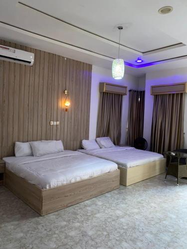 Postel nebo postele na pokoji v ubytování Goldeekion