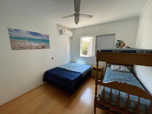 Postel nebo postele na pokoji v ubytování Apto Centro 150m Mar Piçarras 15min Beto Carrero