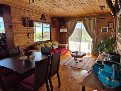 a living room with a couch and a table at Villa Maori Tea Rapa Nui, Easter Island with ocean view in Hanga Roa