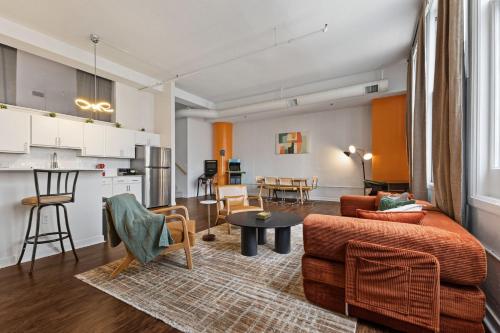 a living room with a couch and a table at New Skywalk Access- Downtown Work Retreat- Sleeps8 in Indianapolis