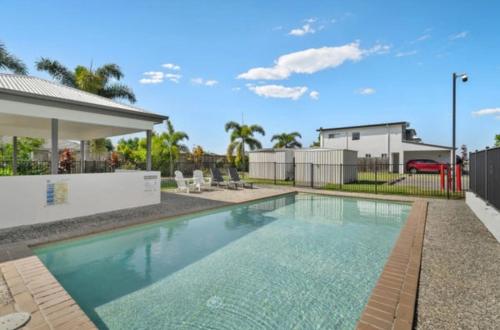a swimming pool in a yard with a house at Syldah Stay Mango Hills in North Lakes