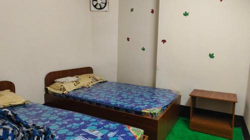 Postel nebo postele na pokoji v ubytování Hotel Priyashi International