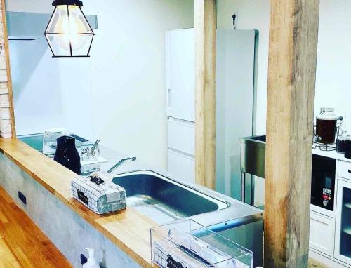 a kitchen with a sink and a counter top at TC1 Nagano - Vacation STAY 10022v in Okaya