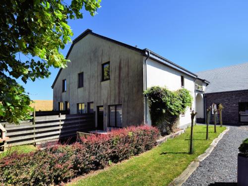 an old barn with a garden in front of it at Cosy Nature Retreat, Houffalize in Houffalize