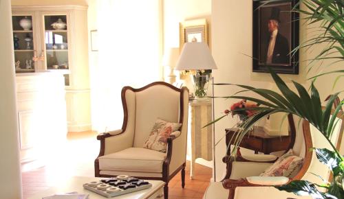 a living room with two chairs and a table at Villa Agnese in Sestri Levante