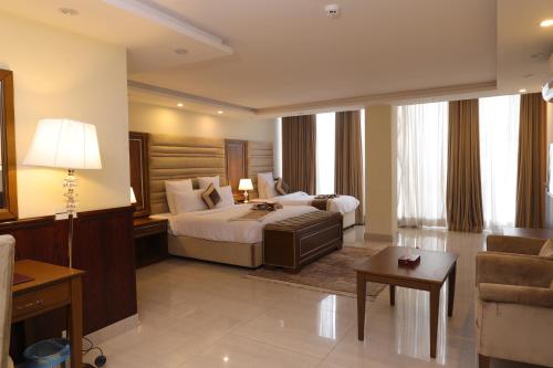 Ένα ή περισσότερα κρεβάτια σε δωμάτιο στο City Oasis Hotel