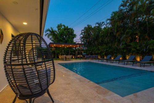 a chair sitting next to a swimming pool at Viva La Villa in Highland Lakes