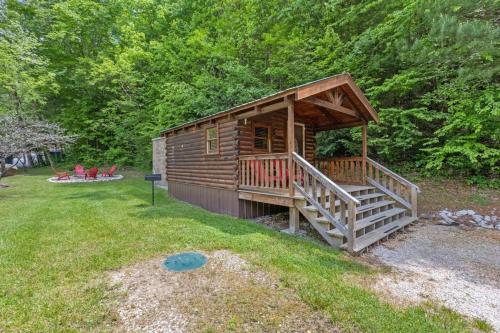 a log cabin with a large deck in a yard at WiFi - Dreamcatcher - Lux-Tiny Cabin in RRG KY in Rogers