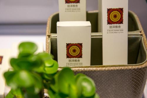 a close up of three products in a purse at Lijiang Merry Inn in Lijiang