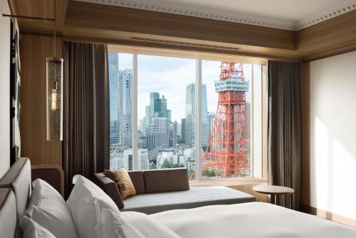 a hotel room with a bed and a large window at The Prince Park Tower Tokyo - Preferred Hotels & Resorts, LVX Collection in Tokyo
