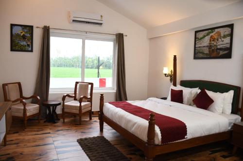 Postel nebo postele na pokoji v ubytování Prakaram Resort & Cafe