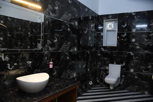 Koupelna v ubytování Prakaram Resort & Cafe