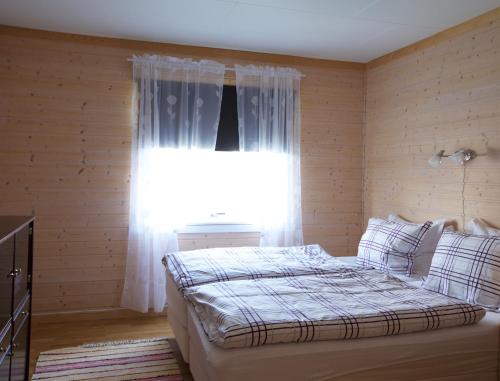 En eller flere senge i et værelse på Nygård Apartments