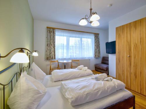 Ένα ή περισσότερα κρεβάτια σε δωμάτιο στο Apartment in Wildschönau with shared sauna, cleaning included