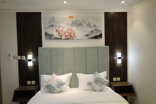 Postel nebo postele na pokoji v ubytování شقق امار للشقق المخدومة حي الازدهار