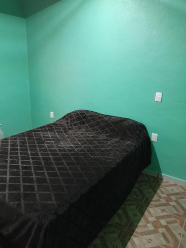 Ένα ή περισσότερα κρεβάτια σε δωμάτιο στο Guanajuato Beli