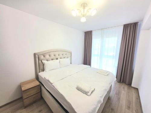Postel nebo postele na pokoji v ubytování Luxury Apartaments in Maurer Residence by Milan-Târgu Mureș
