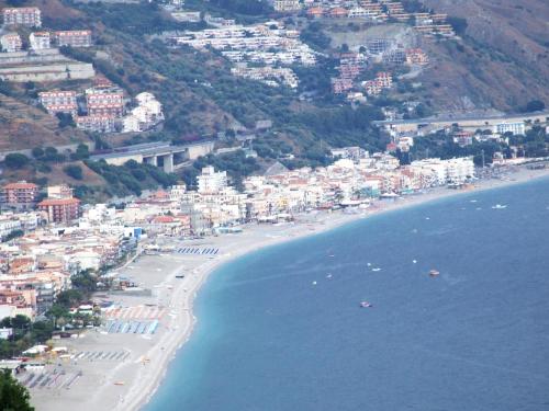 an aerial view of a beach with buildings and houses at Casa Vacanza Da Rosa in Letojanni
