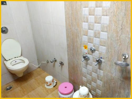 a bathroom with a toilet and a shower at Hotel S B Residency Near Shri Sai Baba Temple - Fully Air conditioned Room - Free Wifi And parking Available - Best Premium Hotel In Shirdi in Shirdi