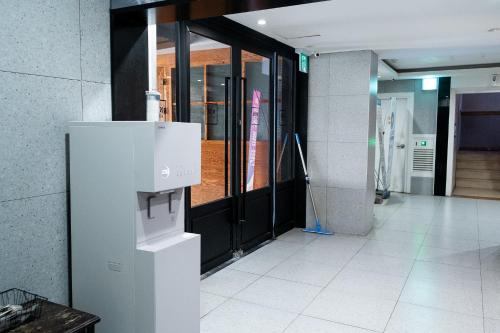 a hallway with a black door and a building at hotel No25 in Incheon
